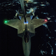Illustration for article titled Cool photos of the F-22 refueling at night on its way to Syria